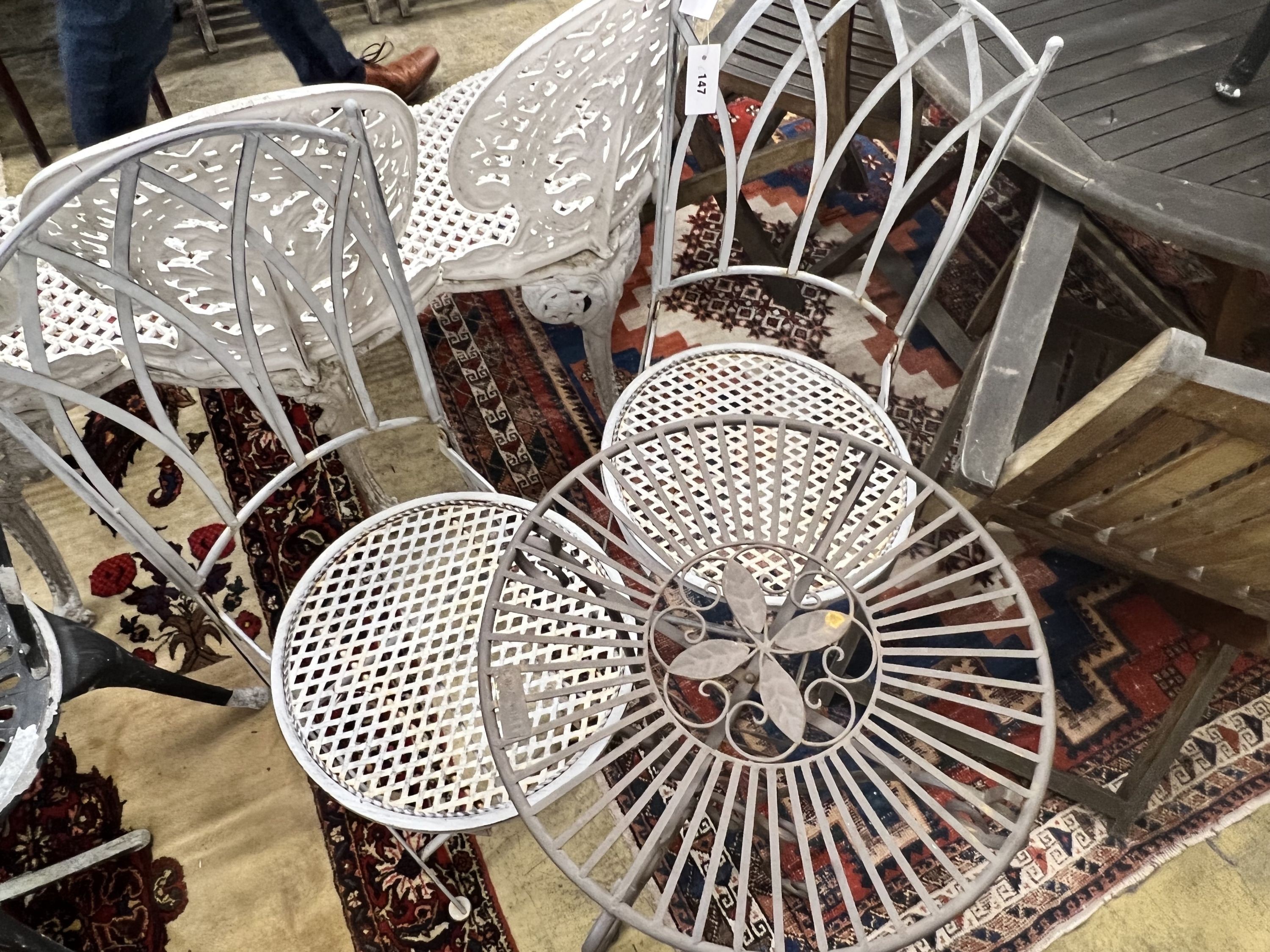 A Laura Ashley circular metal garden table, diameter 43cm, together with two folding garden chairs